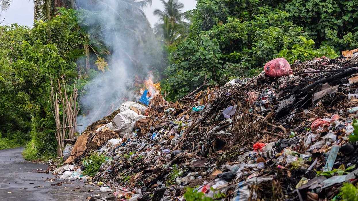 Industrial rubbish burning along the road in the Banda Neira island, Indonesia