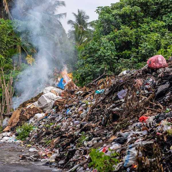 Industrial rubbish burning along the road in the Banda Neira island, Indonesia