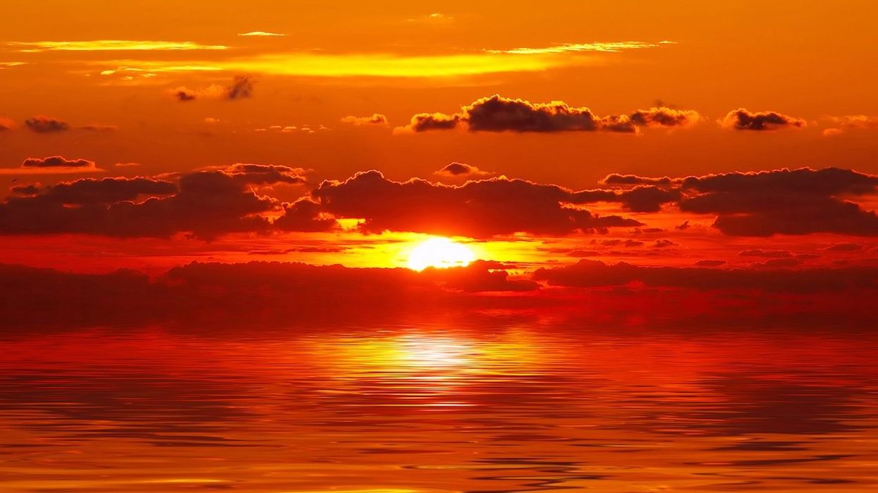 Intensely red sunset over ocean