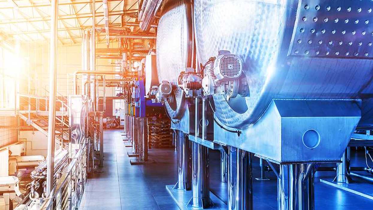 Interior of chemical factory or plant workshop with metal industrial manufacturing production equipment