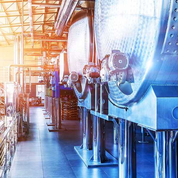 Interior of chemical factory or plant workshop with metal industrial manufacturing production equipment