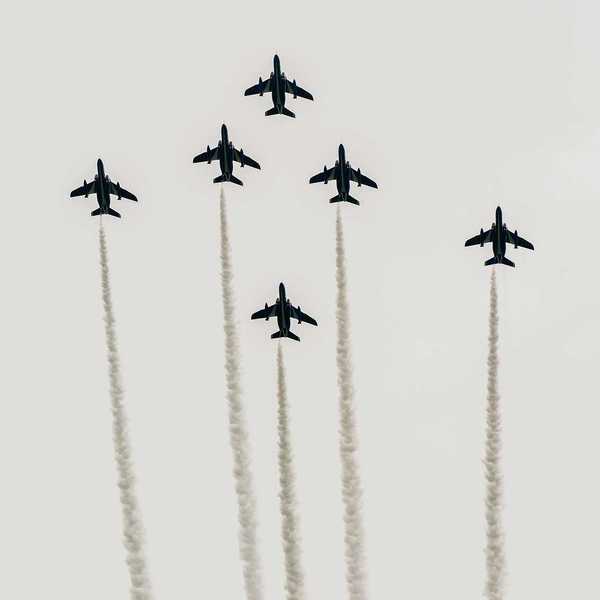 Japanese fighter jets perform maneuvers in flight formation for military drills.