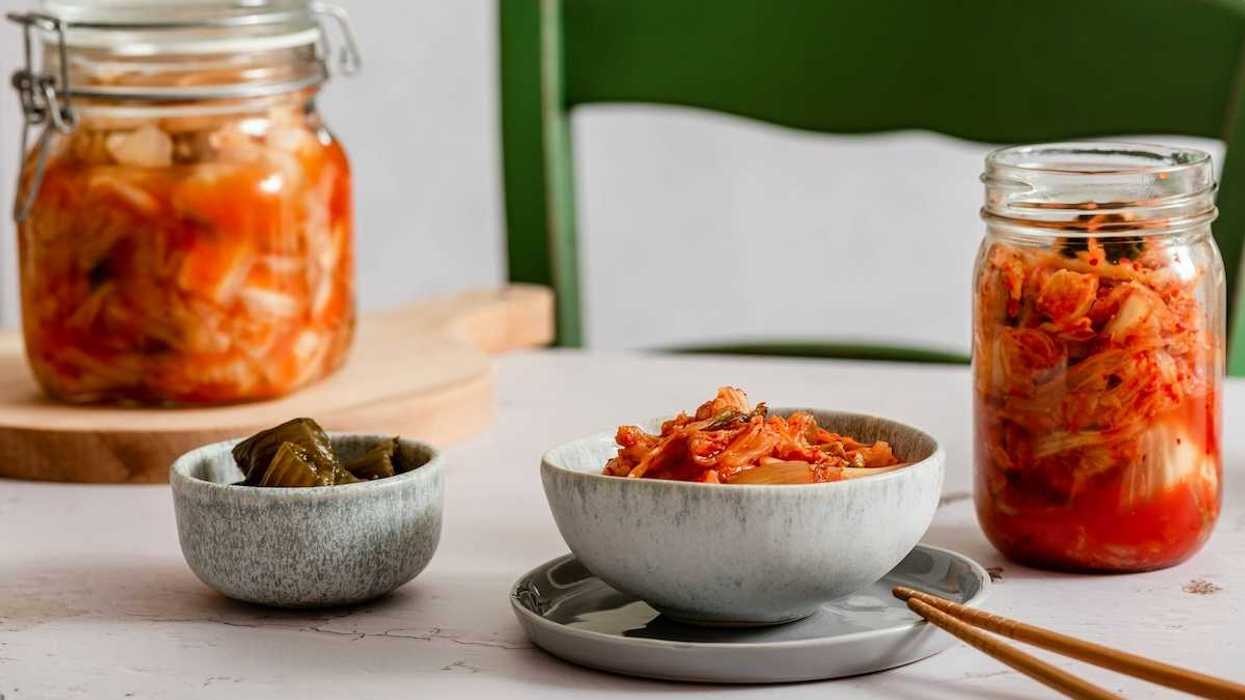 Kimchi and fermented variations in bowls and jars