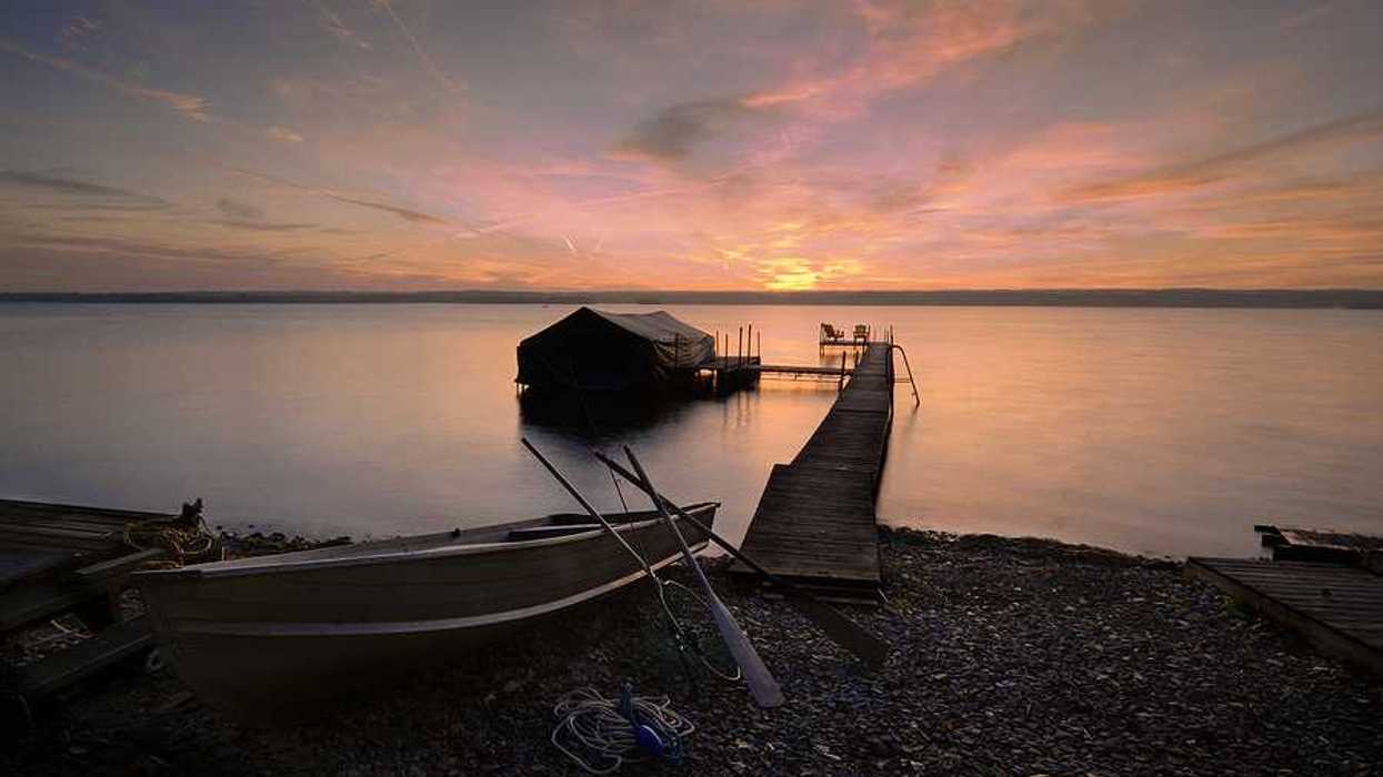 Lake Cayuga dock with sunset in the background