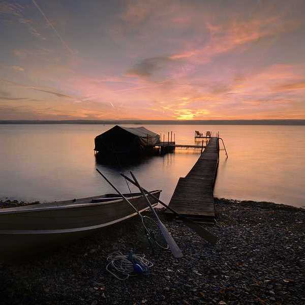 Lake Cayuga dock with sunset in the background