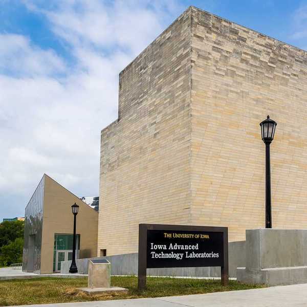 Light-colored brick building, Advanced Technology Laboratories, University of Iowa, Iowa City, Iowa.