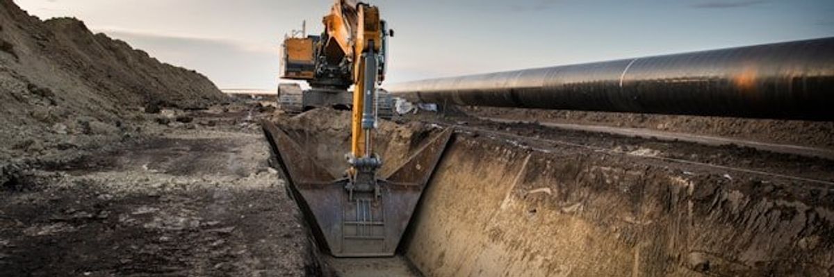 Machinery digging a trench for a pipeline.