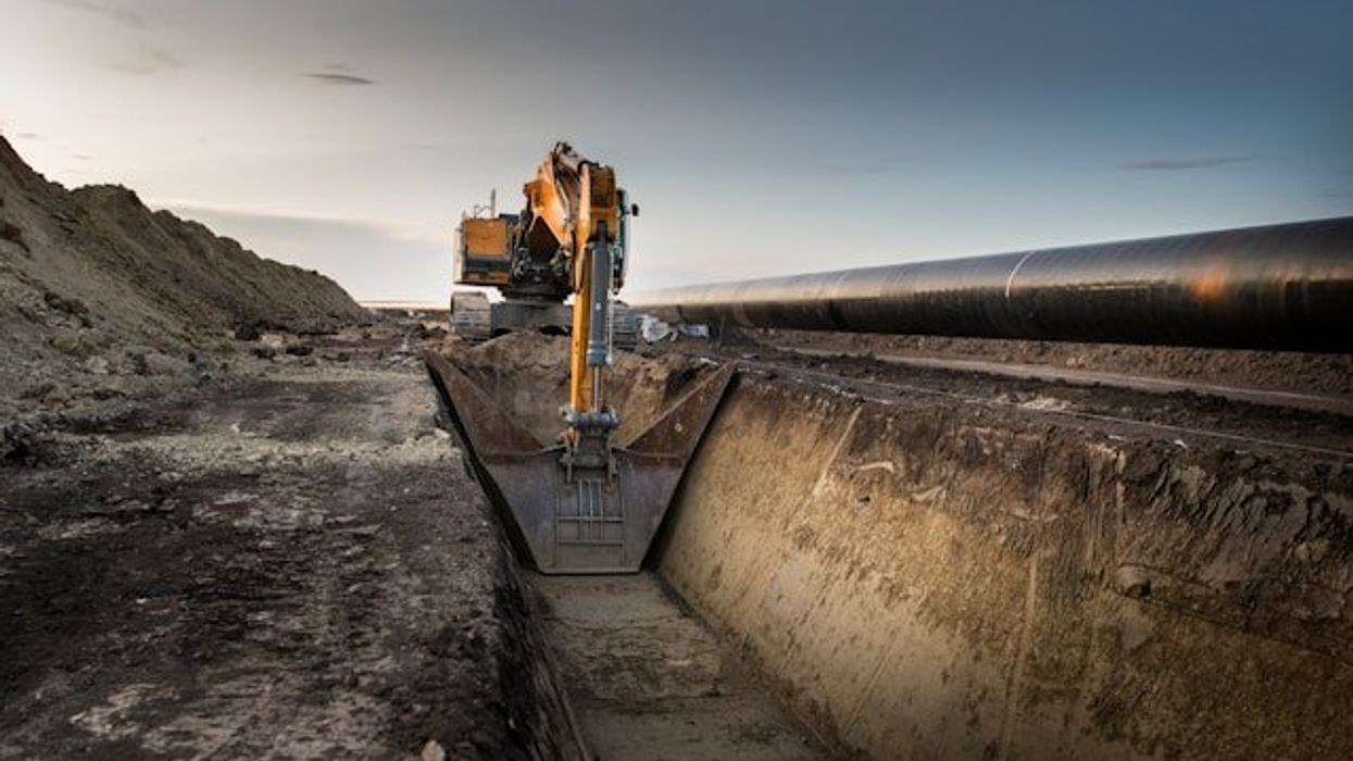 Machinery digging a trench for a pipeline.