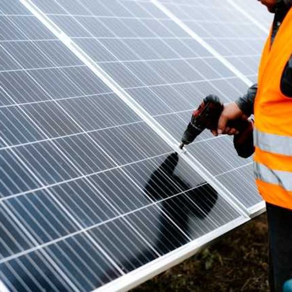 Man installing a solar panel