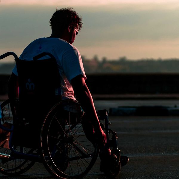 man sitting in wheelchair during daytime.