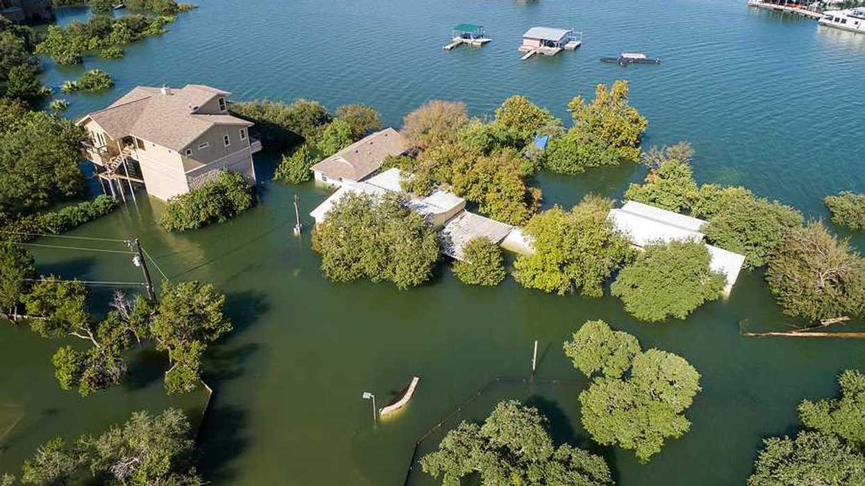 Mansions and luxury homes flooded next to a body of water