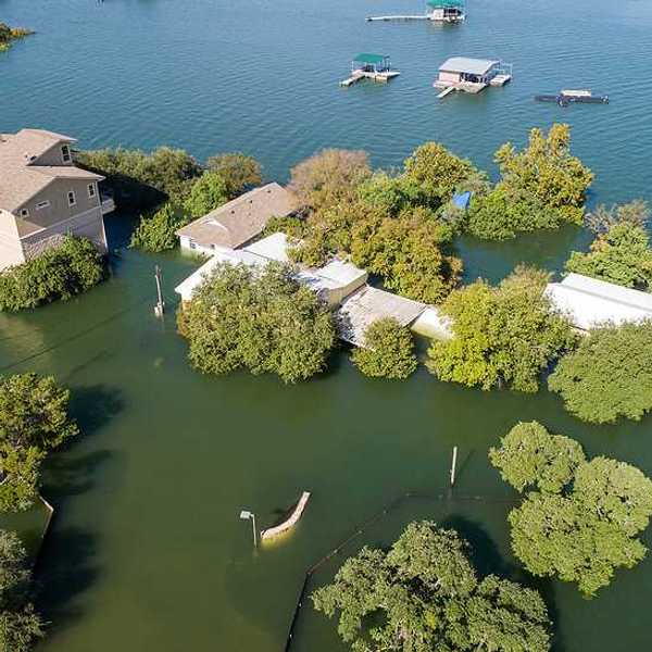 Mansions and luxury homes flooded next to a body of water