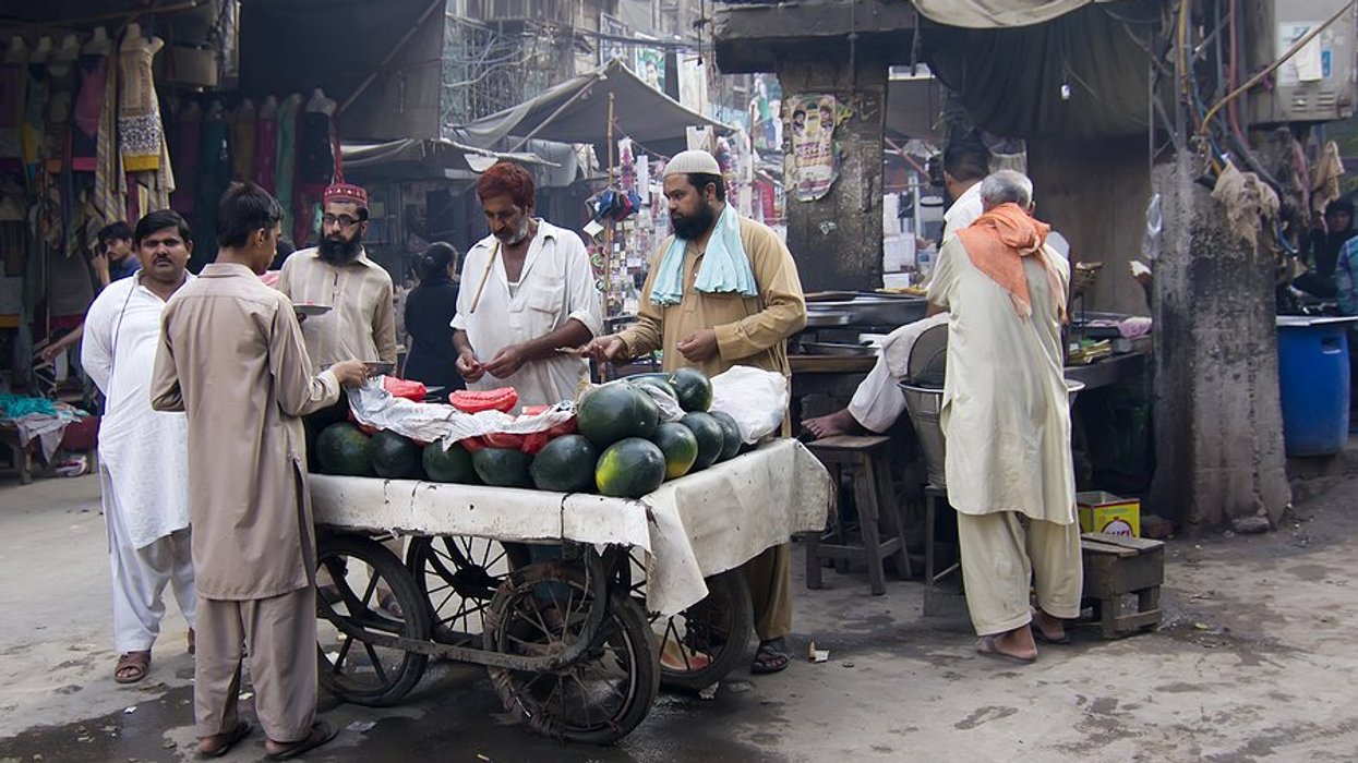 men selling watermelons at an outdoor market