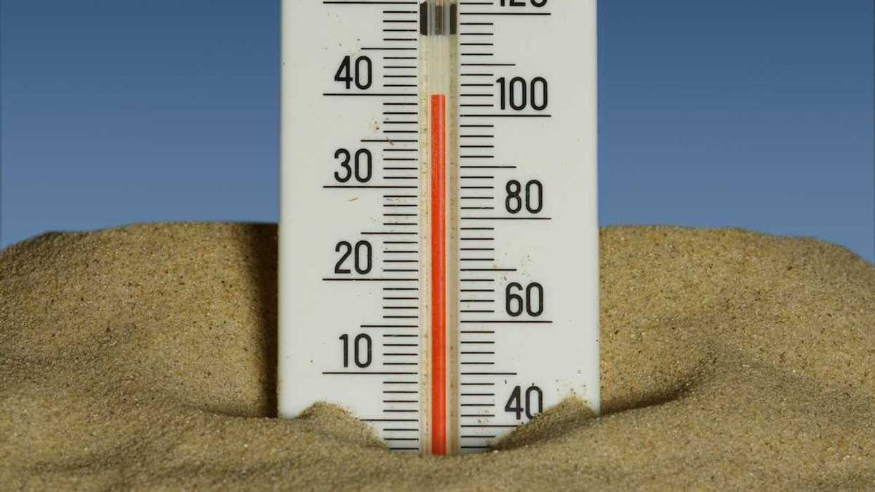 Mercury thermometer stuck in the sand and reading 40 degrees C/104 degrees F