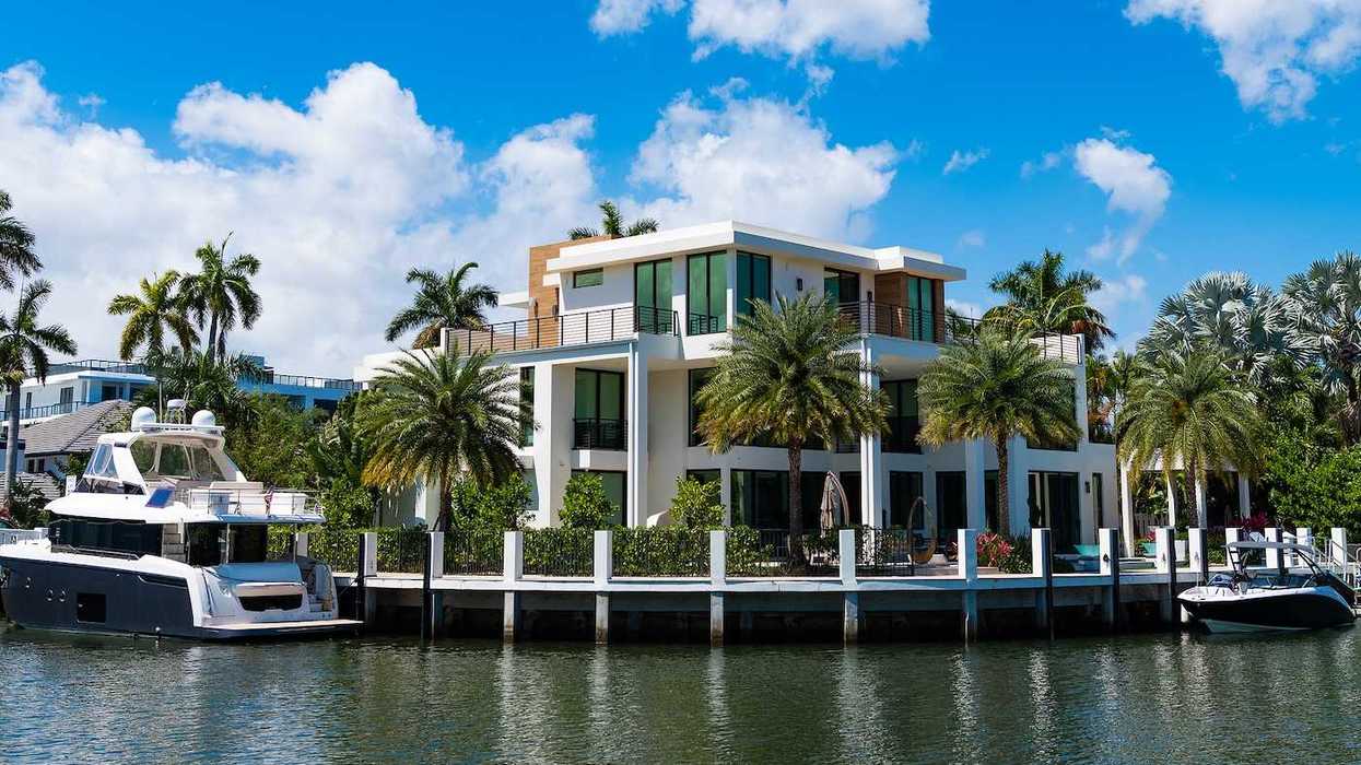 Modern luxury villa with private yacht