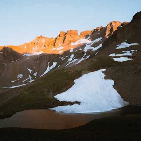 Mountains in the sun with a small amount of snow