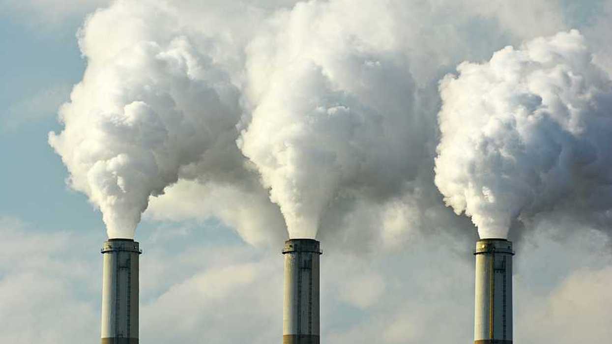 Multiple smokestacks emitting toxic air pollution