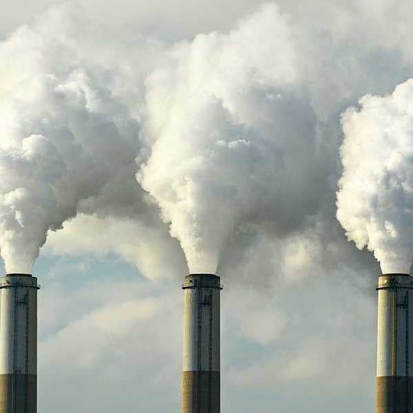 Multiple smokestacks emitting toxic air pollution