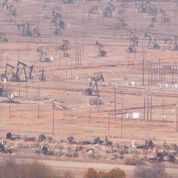 Myriad pump jacks working a crowded California oil field.
