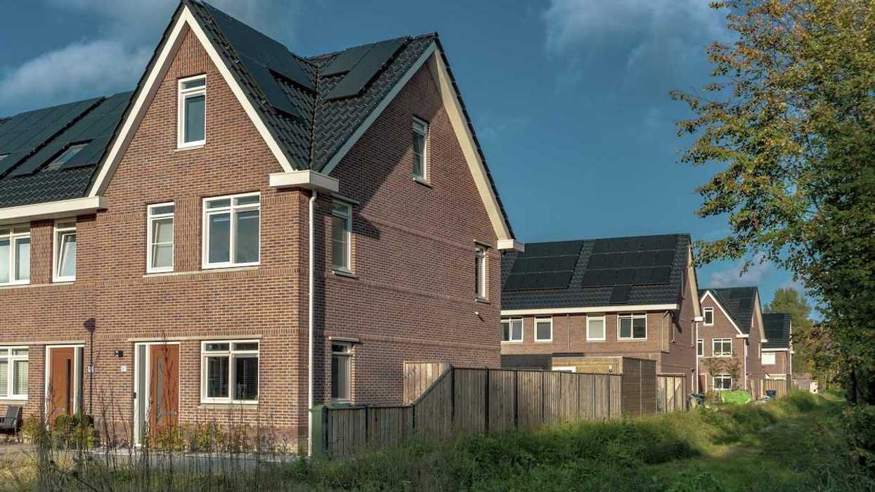 Newly built brick houses with solar panels