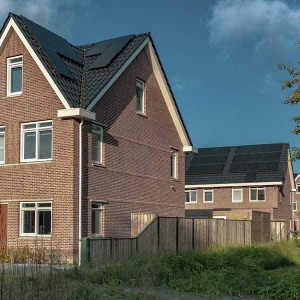 Newly built brick houses with solar panels