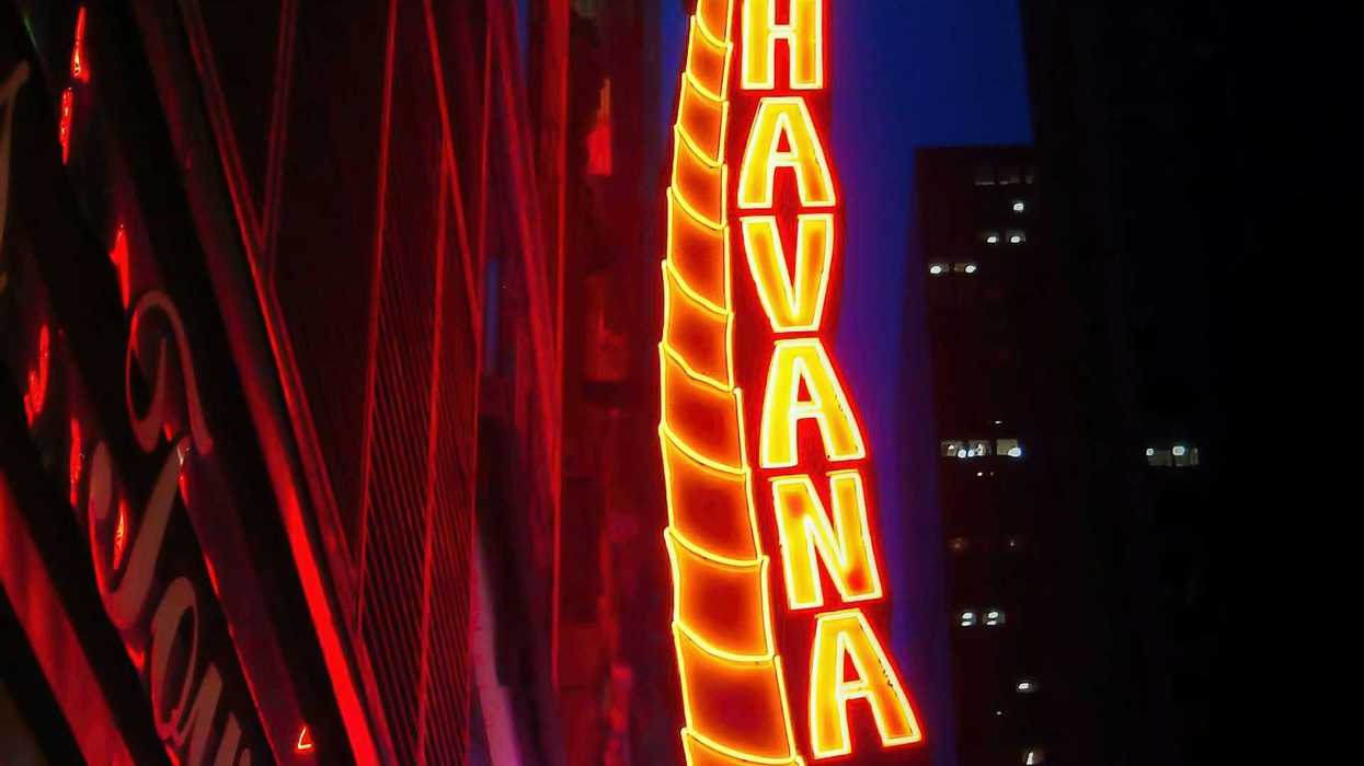 Nighttime view of decorative neon sign reading "Havana Central"