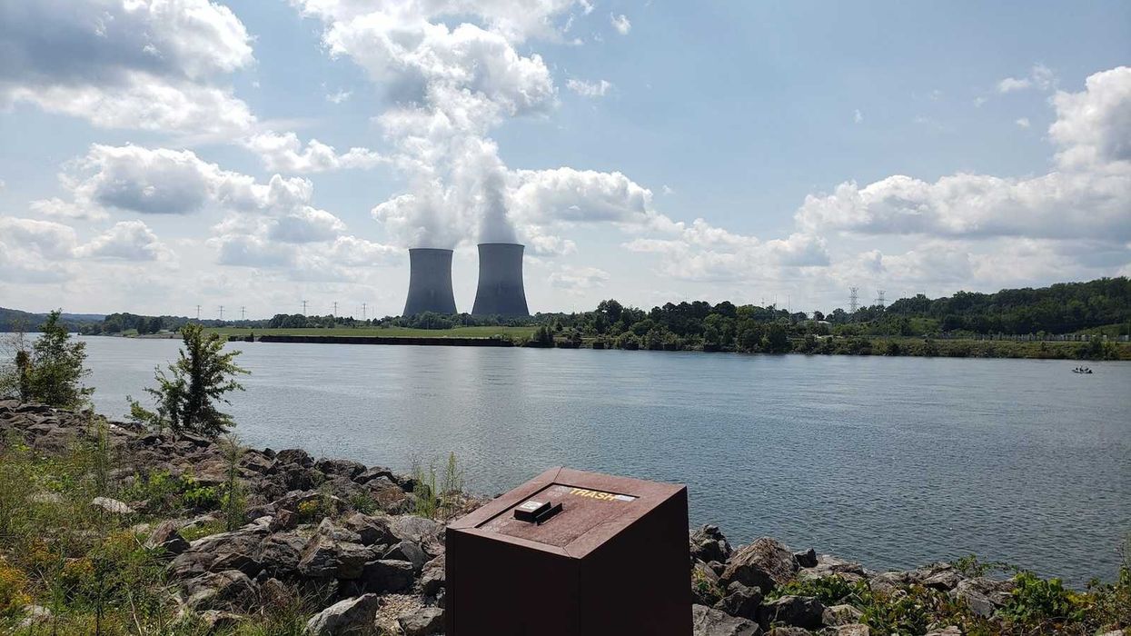 Nuclear plant cooling towers on a river