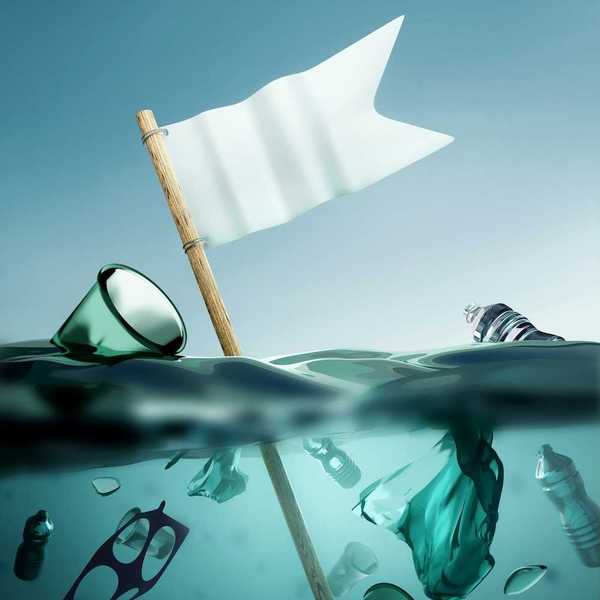 Ocean plastics suspended below surface in seawater along with a "white flag."