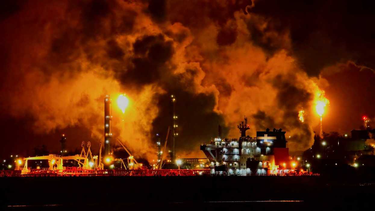 Oil and gas facility flaring excess methane at night