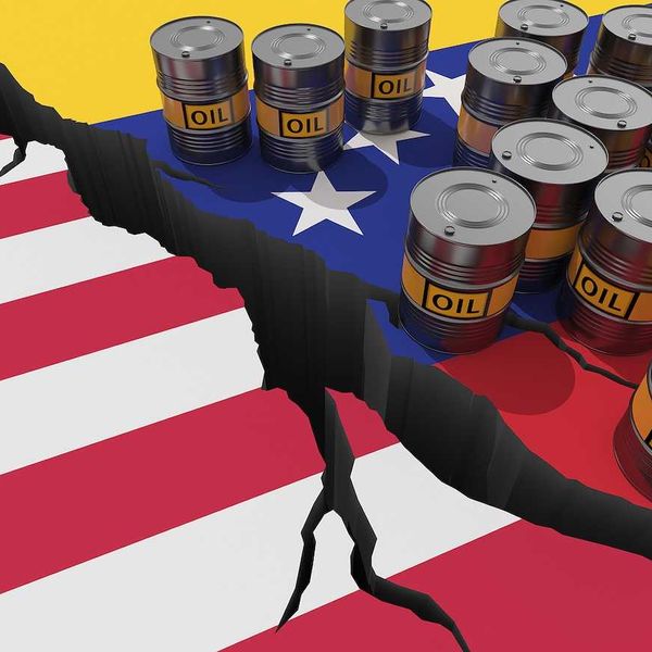 Oil barrels on background of the flags of Venezuela and USA.