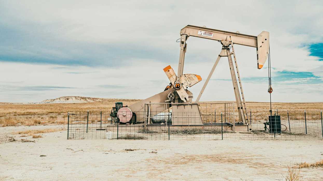 Oil pump jack in dry plains.