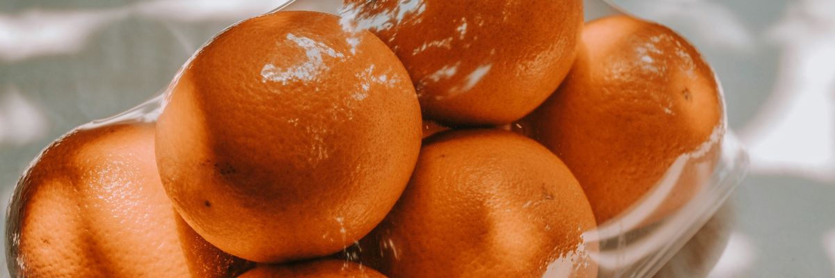 orange fruits on white plastic pack