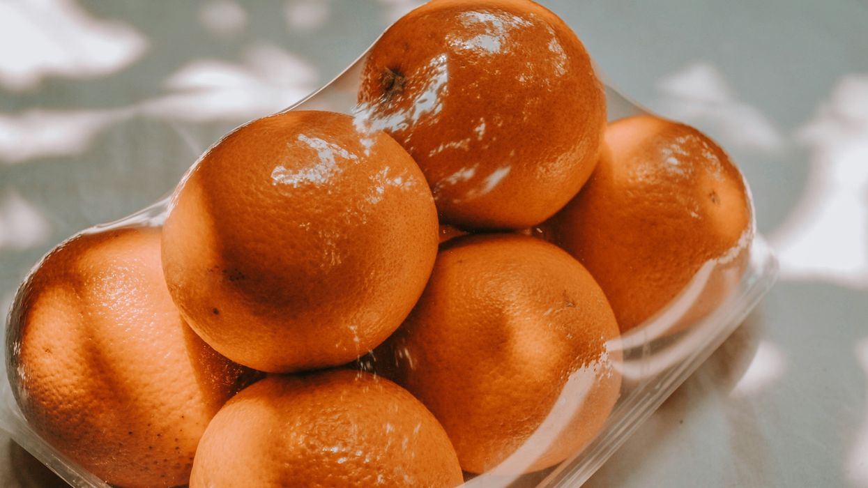 orange fruits on white plastic pack