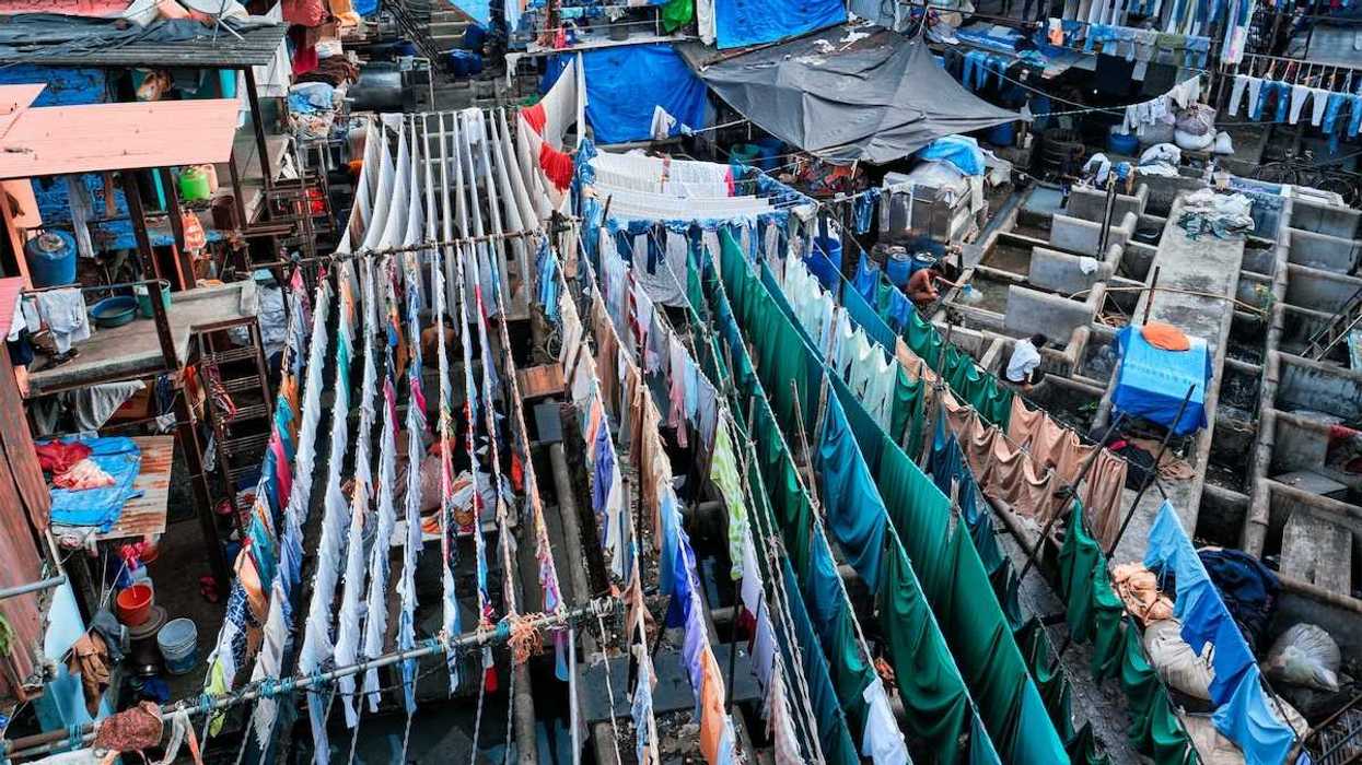 Outdoor textile market. Many textiles hanging on multiple lines