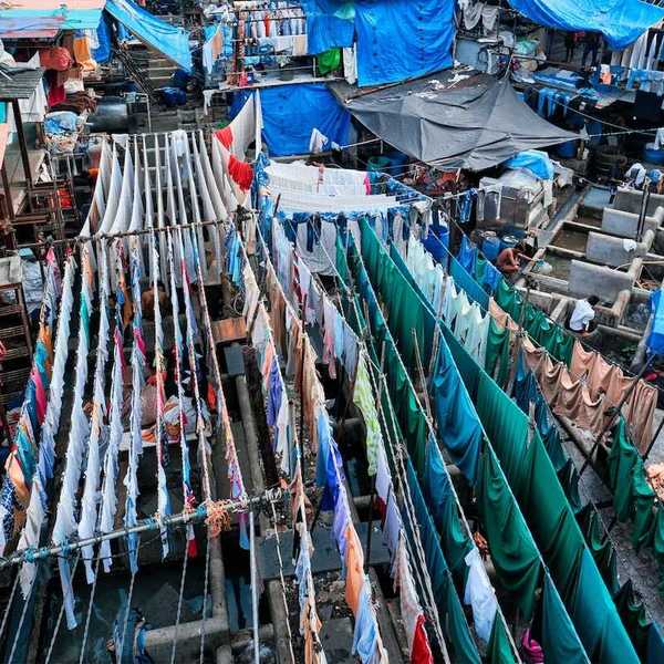 Outdoor textile market. Many textiles hanging on multiple lines