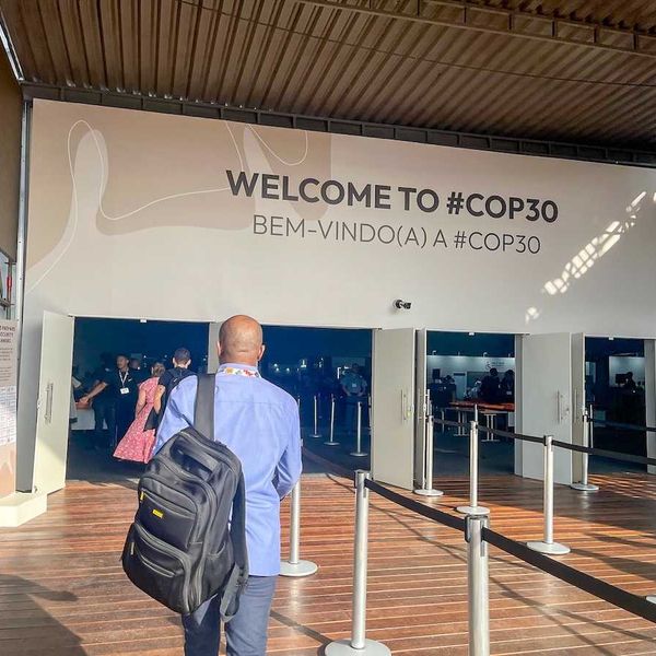 participants at the entrance to COP 30 pavilion