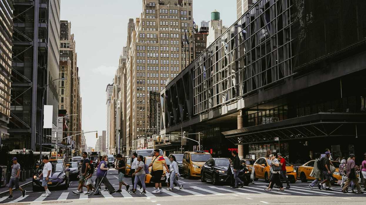 Pedestrians cross a NYC street