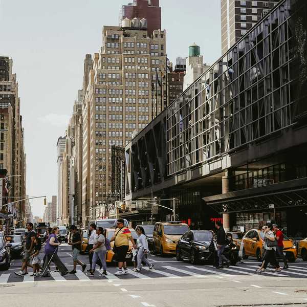Pedestrians cross a NYC street