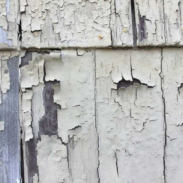 Peeling paint, likely containing lead