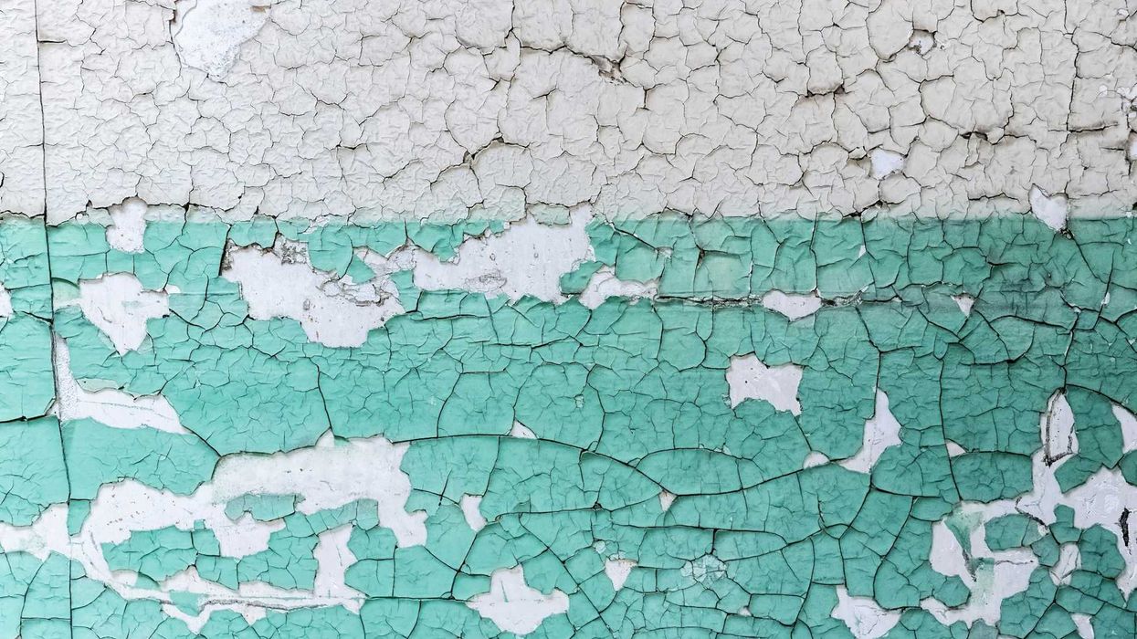 Peeling white & turquoise-colored paint