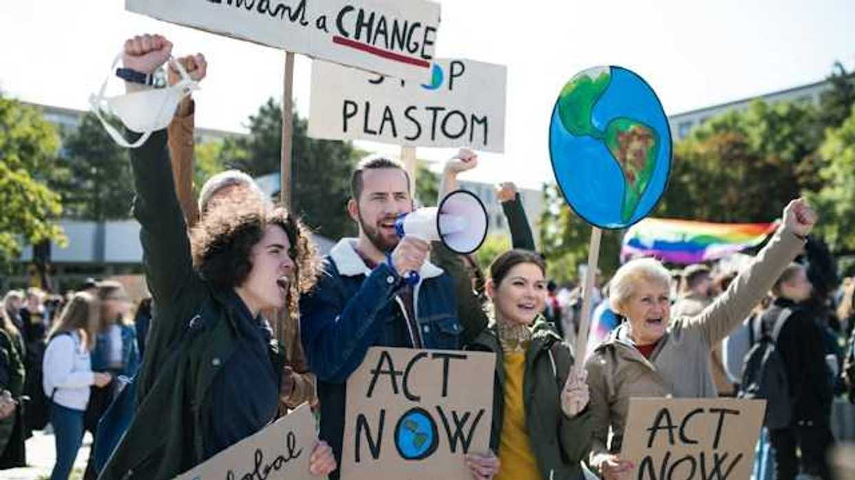 People with signs at a climate protest