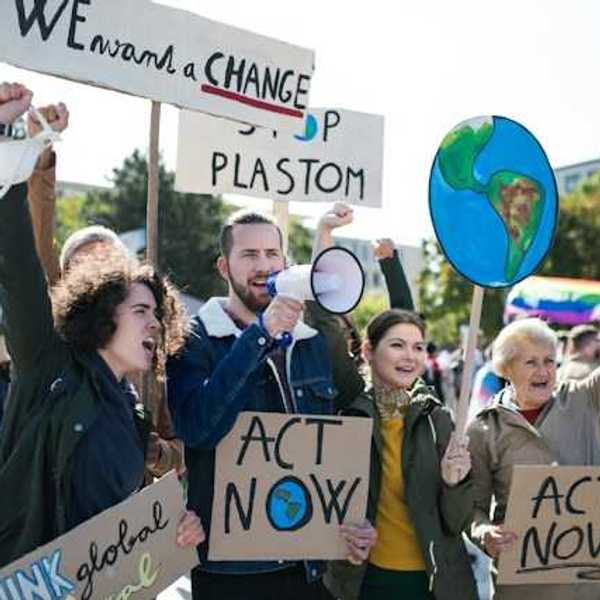 People with signs at a climate protest