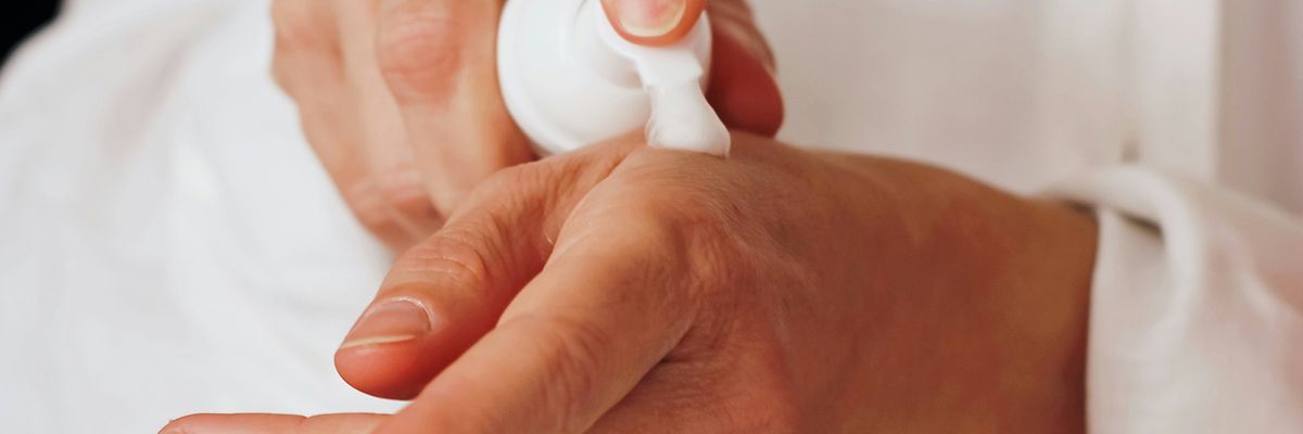 person applying lotion