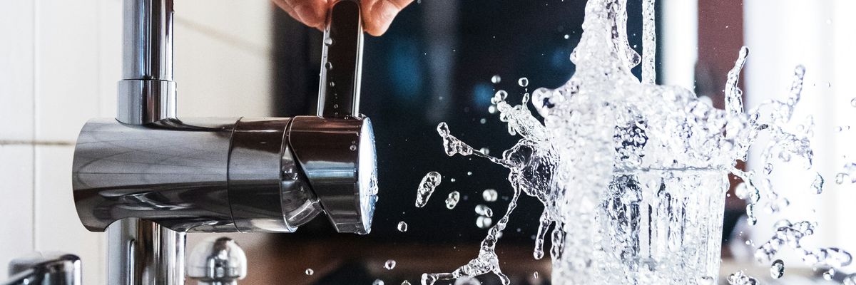 person opening faucet
