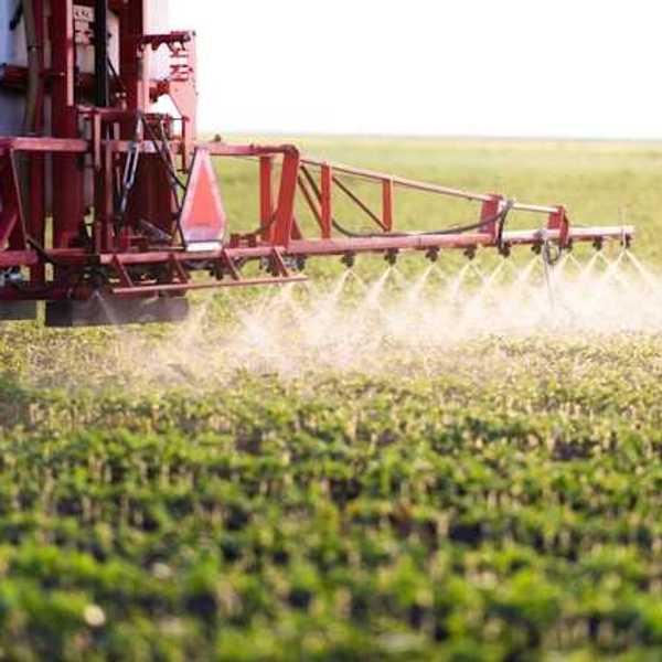 Pesticides being sprayed on a farm field
