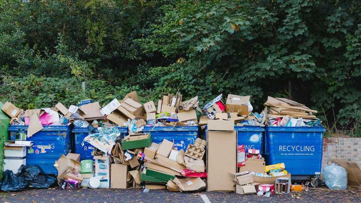 Pile of materials and overflowing bins designated for recycling