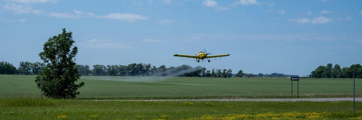 plane spraying pesticides