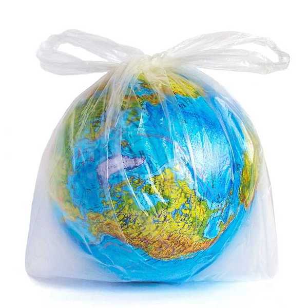 Planet Earth (globe) in polyethylene plastic disposable package, isolated on white background.