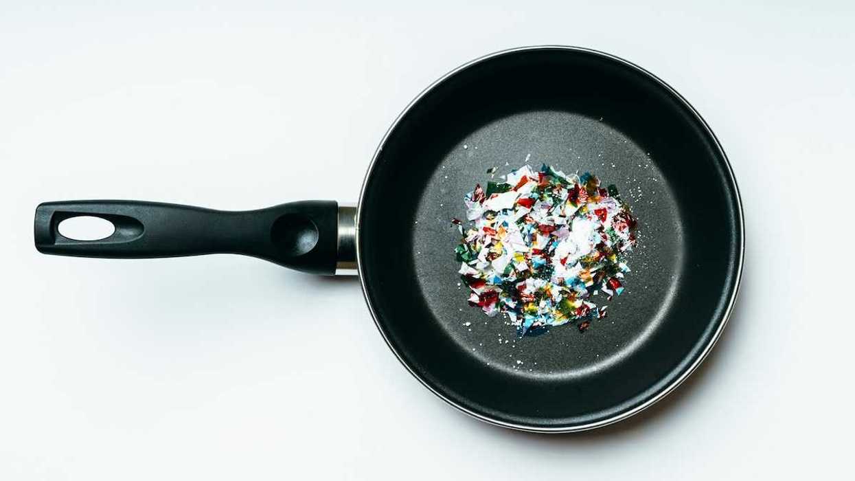 Plastic pieces displayed in a coated frying pan indicative of pyrolysis