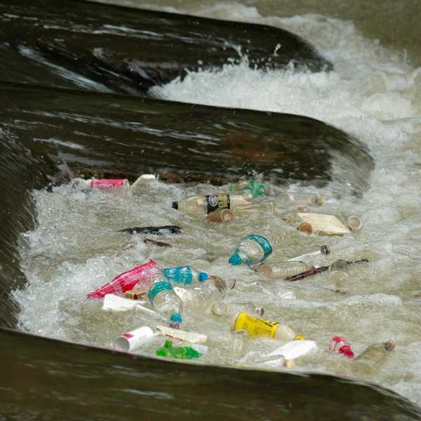 plastic trash bobbing in a river